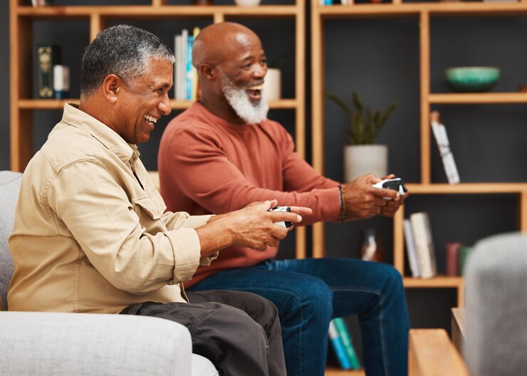 gaming-fun-senior-black-man-friends-playing-video-game-together-living-room-home-sofa-funny-retirement-with-mature-male-gamer-friend-enjoying-house-visit-game_590464-143070